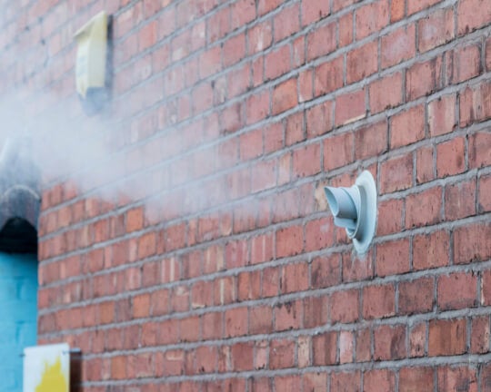 Horizontal flue through external wall
